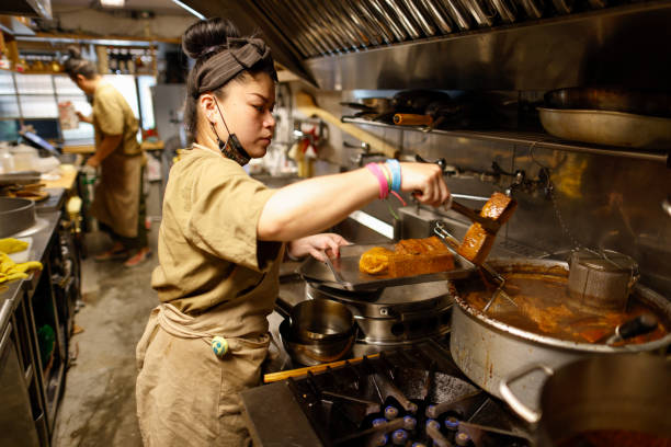 istock Chef making food in the kitchen 1306858077