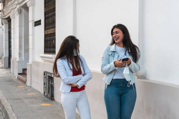 istock Two attractive young women outdoors 1306858155