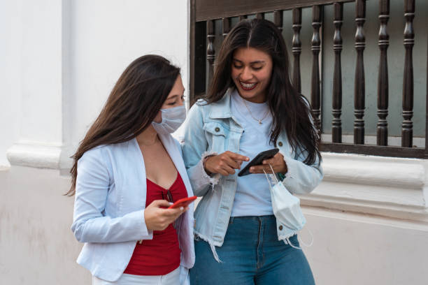 istock Two attractive young women outdoors 1306858249