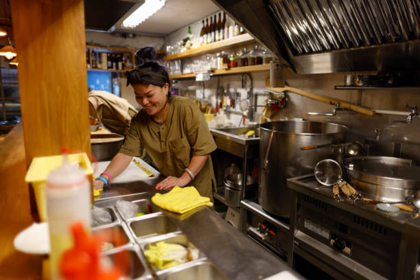 istock Female chef busy cooking in the kitchen 1306858271