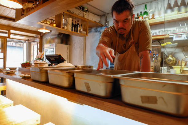 istock Chef making food in the kitchen 1306859259