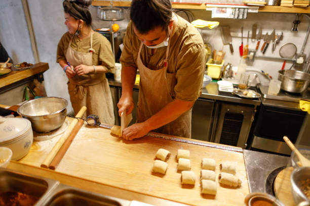 istock Chef making food in the kitchen 1306859343