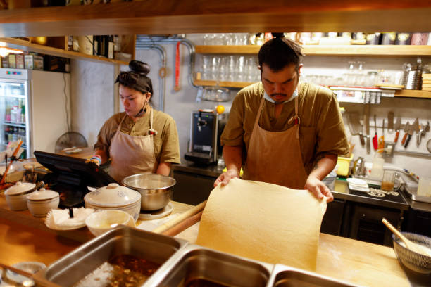 istock Chef making food in the kitchen 1306859441