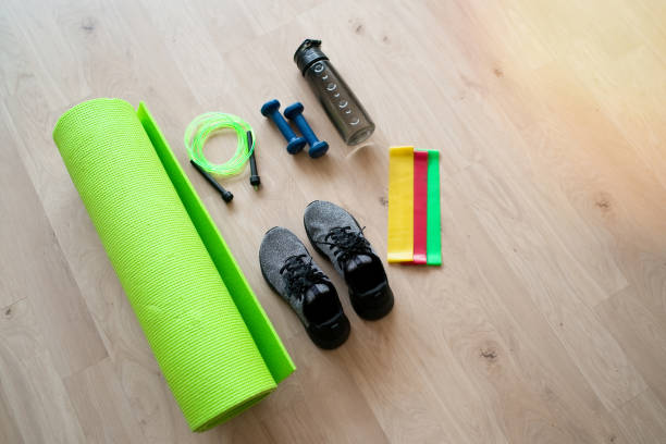 istock Fitness accessories on wooden background 1306859648