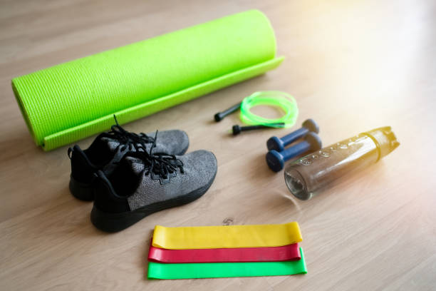 istock Fitness accessories on wooden background 1306859651