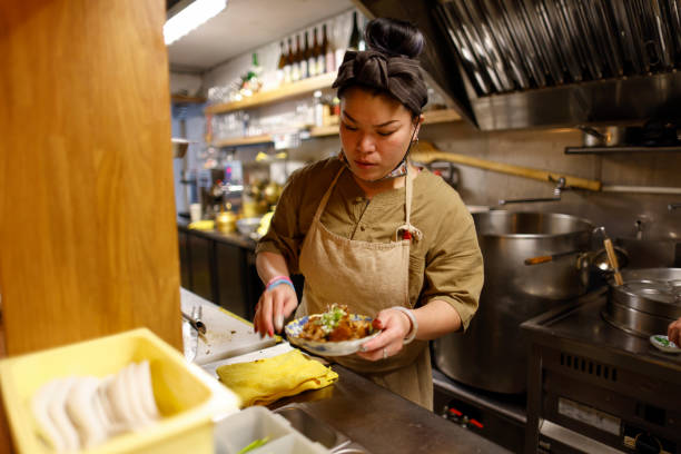 istock Chef making food in the kitchen 1306859920