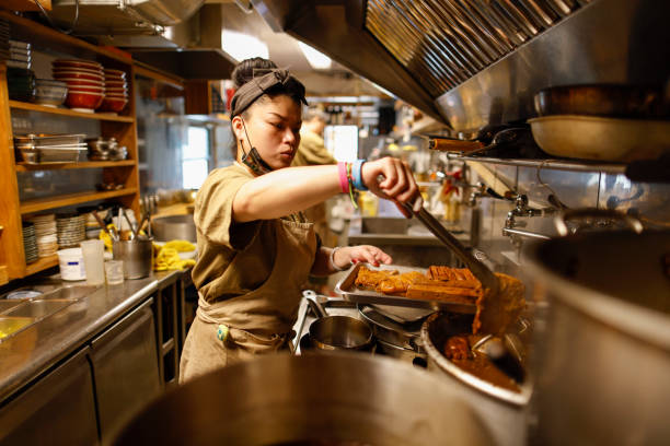 istock Chef making food in the kitchen 1306859963