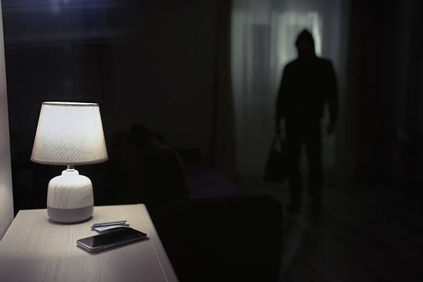 istock Burglar inside of a house 1306860872
