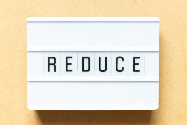 istock Lightbox with word reduce on wood background 1306863344