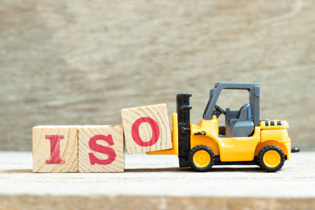 Toy forklift hold letter block o to complete word iso on wood background Toy forklift hold letter block o to complete word iso on wood background organization improvement risk finance stock pictures, royalty-free photos & images