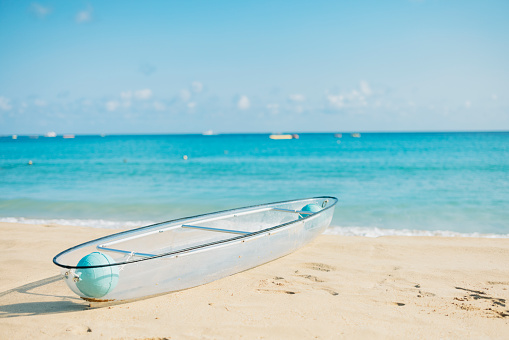 Transparent canoe on the beach