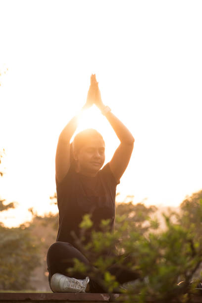 istock Indian Lady In park stock photo doing exercise 1306864889
