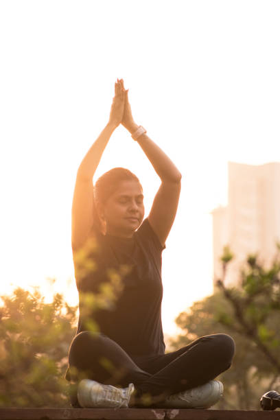 istock Indian Lady In park stock photo doing exercise 1306864917