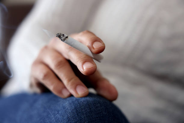 istock The hands of female holding cigarette 1306865974