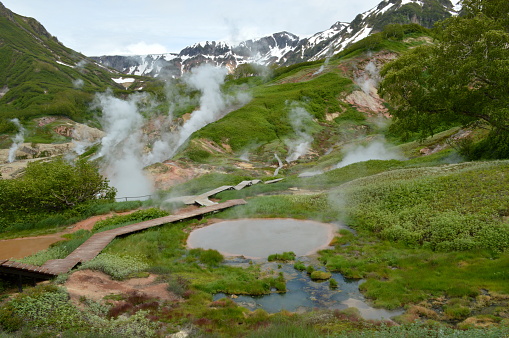 Smoke is coming out of fumaroles in the Valley of Geysers in Kamchatka, Russia