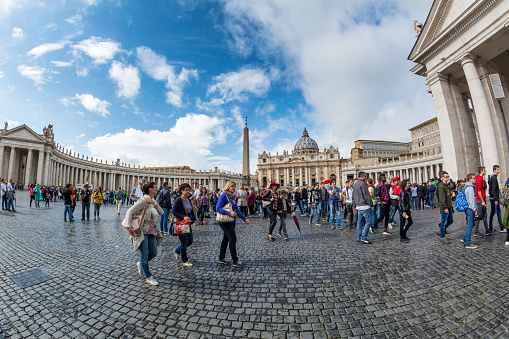 Vatican - Oct 06, 2018: Tourists bustle around St. Peter's Square in front of St. Peter’s Cathedral