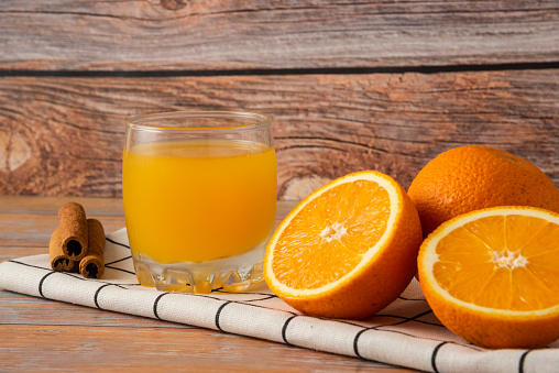 Oranges sliced and served with a cup of juice. High quality photo