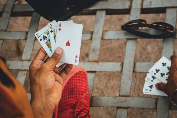 istock Playing cards in the hand 1306869245
