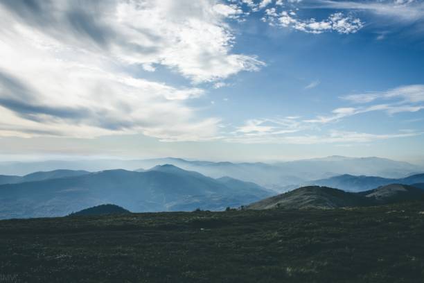 istock Blue with Sky in a windy day. Distant Mountains in a haze. Mysterious landscape. 1306869404