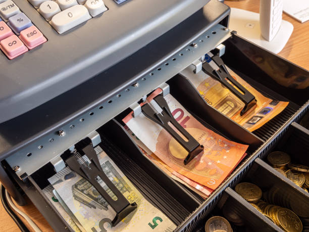 istock Cash register with change in a shop 1306870237