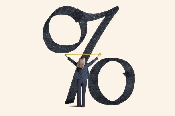 istock Woman Measures Inflation Or Rising Interest Rates 1306871635