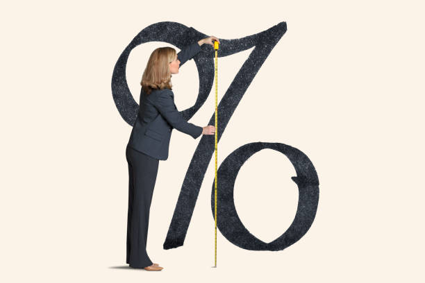 istock Woman Measures Inflation Or Rising Interest Rates 1306871636