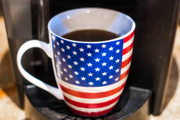 istock American flag coffee mug on coffee maker. 1306873118