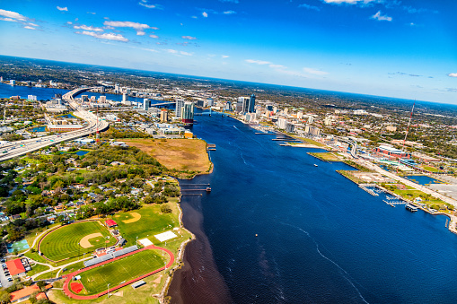 Wide angle aerial view of the beautiful city of Jacksonville Florida along the St. Johns River.