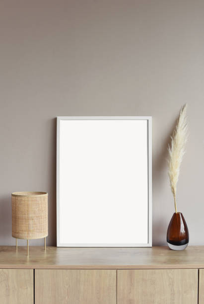 istock Blank picture frame mockup on a wall. Artwork showcase in a living room 1306877913