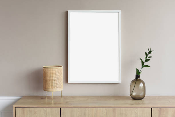 istock Blank picture frame mockup on a wall. Artwork showcase in a living room 1306877914