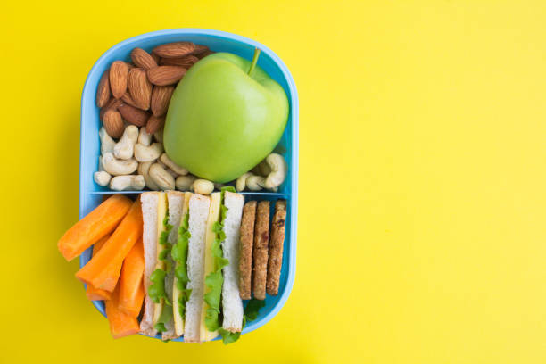 istock Lunch in the blue box on the yellow background 1306878812