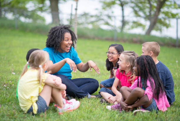 istock Camp Counselor and Children at Summer Camp 1306879311