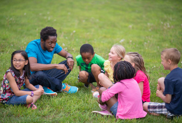 istock Camp Counselor and Children at Summer Camp 1306879315