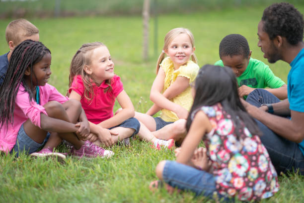 istock Camp Counselor and Children at Summer Camp 1306879317