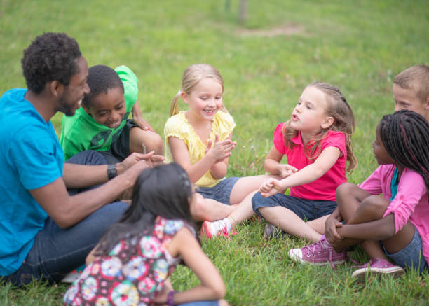 istock Camp Counselor and Children at Summer Camp 1306879318