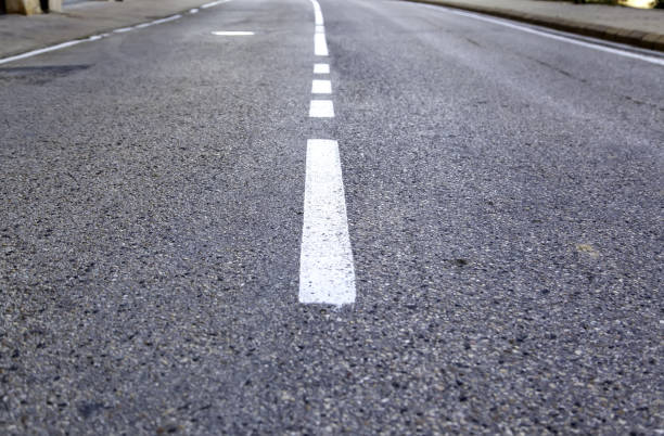 istock Direction line for cars on a road 1306882956