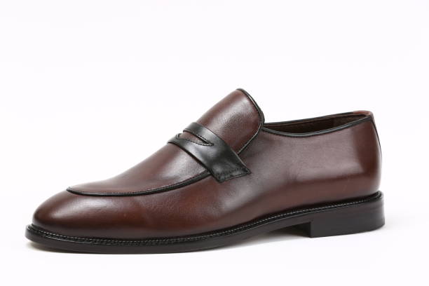 istock Mens brown leather shoes isolated 1306883476
