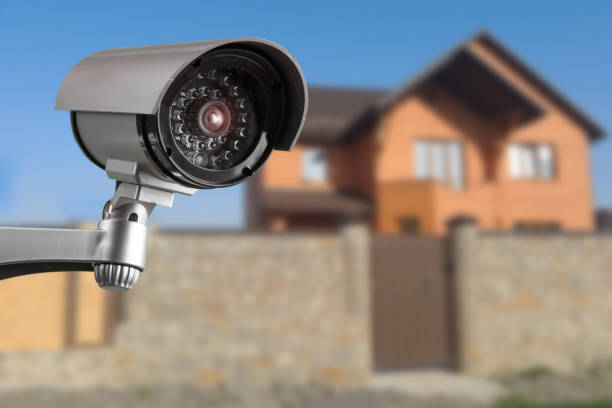 istock camera and private house on the background 1306883522