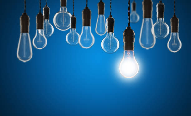 istock Idea and leadership concept - bulbs on the grunge background 1306883566