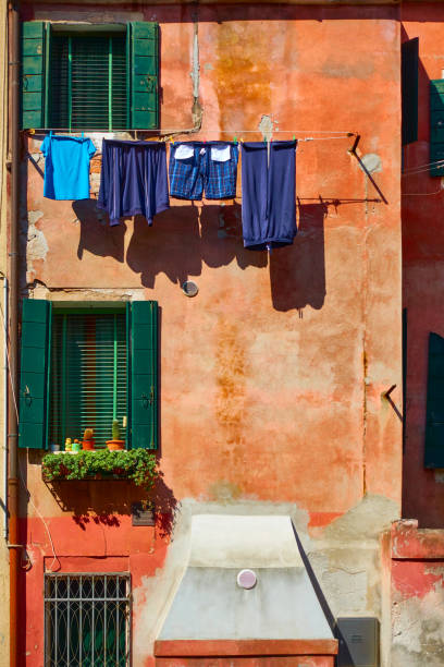 istock House and clothes drying on rope outdoors in Venice 1306885698