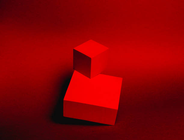 istock pedestal of two cubes on a paper background 1306885743