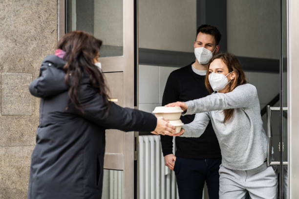 istock Neighbor Giving Rescue Food Help 1306891421