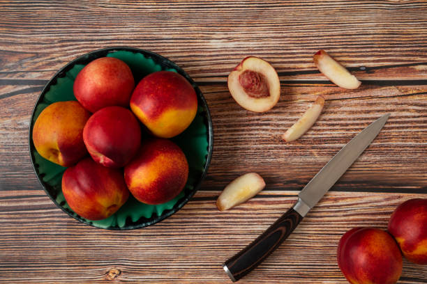 istock Red and yellow peaches in a green platter 1306892438