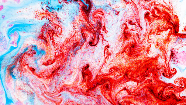 istock Fluid art. Abstract colorful background, wallpaper. Liquid marbling background. Mixed blue and light pink paints. Trendy colorful backdrop 1306892746