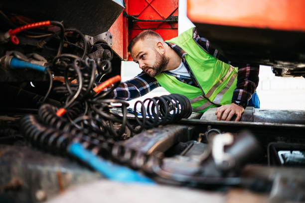 Truck driver Truck inspection and safety, Truck driver daily checking the semi truck trailer. repairman stock pictures, royalty-free photos & images
