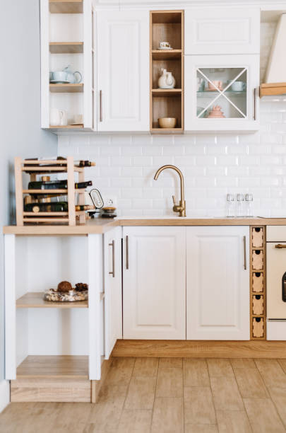 istock Bright kitchen in the Scandinavian style with dishes and kitchen accessories on the table... 1306896933