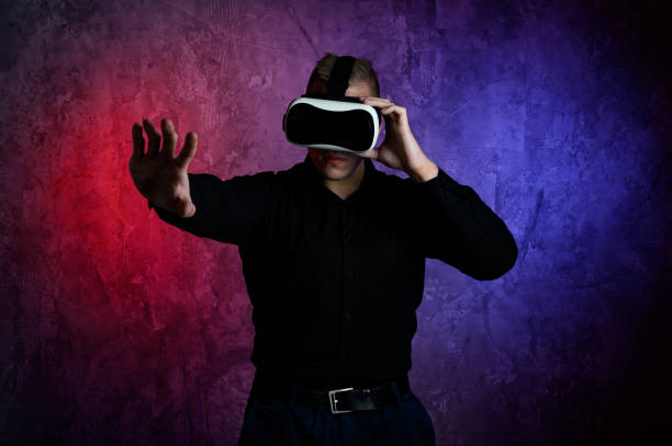 istock Portrait of young man with 3D virtual reality glasses 1306900380