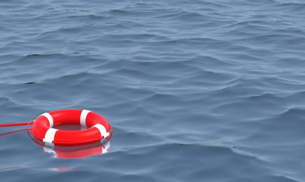 istock Red lifebuoy in the ocean 3D Render. 1306902606
