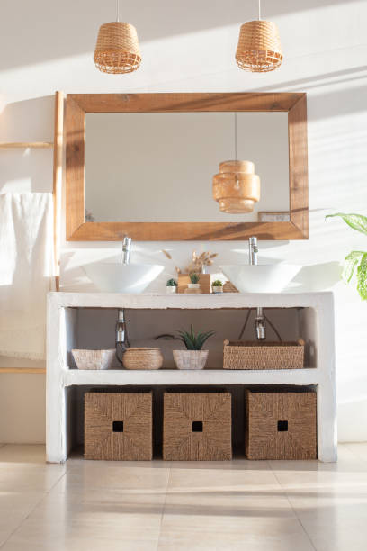 istock Stylish modern interior of a bright, white bathroom with two sinks 1306902623