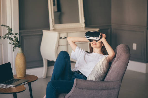 istock young woman uses virtual reality glasses in beautiful flat 1306907364